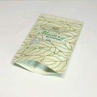 Sachet Doypack Noir Mat Personnalisé avec Impression Métallisée et Motif Feuille Métallique, Refermable avec Fermeture Éclair, pour Emballage de Thé