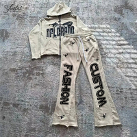 Fabricant de vêtements logo personnalisé bouffant impression coton manchette bord coupé vintage décontracté hommes sweat à capuche zippé et pantalon évasé ensemble