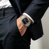 Montre à quartz simple avec cadran carré et affichage de la date, bracelet en acier léger pour un look décontracté au quotidien