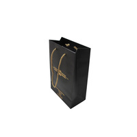Vente en gros de sacs d'emballage en papier noirs avec logo imprimé personnalisé pour chaussures et vêtements sac d'emballage en papier pour cadeau et bijoux pour achats
