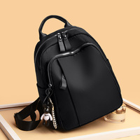 Sac à dos en nylon imperméable tendance et élégant pour femmes de bureau, convertible en sac à bandoulière, avec fermeture éclair et doublure en polyester – Collection 2026 à succès