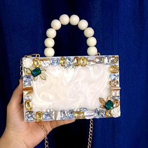Elegant white resin clutch with beaded handle, <b>crystal</b> embellishments, and gold chain for weddings and parties. - Product Image 1