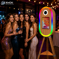 Photomaton ovale en bois commercial - 4 modes d'éclairage, support de caméra intégré, caméra HD et imprimante DNP pour les entreprises de location