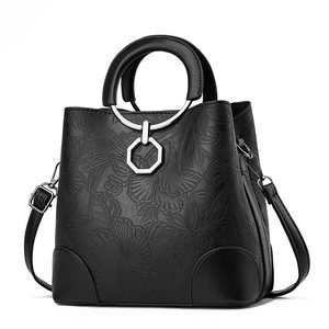 Sacs à main pour femmes en cuir PU brillant de haute qualité, à bandoulière, avec pendentif fleur, vente en gros - Product Image 6
