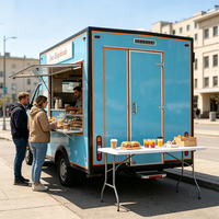 Remorque alimentaire commerciale avec fenêtre de service, plancha à gaz et comptoir pour burgers dans les rues de San Francisco