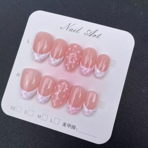 Las uñas cortas de almendra hechas a mano de alta calidad, borde de estilo francés blanco, se pueden reutilizar, venta al por mayor de fábrica - Product Image 1