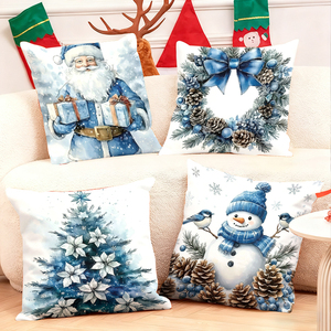 Bantal Natal dengan desain Santa, manusia salju, karangan bunga, dan pohon dalam warna biru dan putih yang nyaman. - Product Image 1