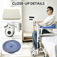 Chaise élévatrice hydraulique bleu foncé pour transfert de patients avec accoudoirs et fonction toilette intégrée pour soins aux personnes âgées