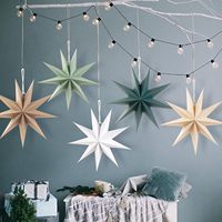 Vente en gros de lanternes en papier de 30cm décoration de fête de Noël étoiles suspendues en papier faites à la main ornement étoile en papier pour la décoration de la maison