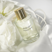 Bouteille de parfum en verre cylindrique de luxe de 100ml boîte d'emballage de cosmétiques vide avec atomiseur de pompe de pulvérisation pour bouteille d'huile essentielle