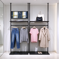 Portant à vêtements noir en métal tubulaire, étagère de présentation multi-niveaux, certifié CE ETL, vente en gros pour boutiques et détaillants