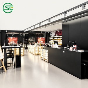 Estantería de Pared con Marco Dorado, Estantes de Vidrio y Gabinetes Blancos para Tienda de Perfumes - Product Image 3
