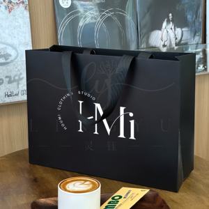 Emballage de <span class=keywords><strong>sac</strong></span> en papier kraft de luxe recyclable avec logo imprimé personnalisé <span class=keywords><strong>sac</strong></span> en papier avec poignée de magasinage de cadeau de vêtement imprimé avec logo - Product Image 3