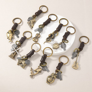 Llavero de Metal con Diseño Retro Punk Creativo, <span class=keywords><strong>Cuerda</strong></span> de Cuero Trenzada, Colgante de <span class=keywords><strong>Guitarra</strong></span>, Búho, Tortuga, Molino de Viento, Serpiente, Joyería, Regalo <span class=keywords><strong>para</strong></span> Hombre - Product Image 1