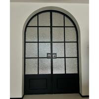 Porte intérieure à double battant en verre avec design arqué et cadre en alliage de titane