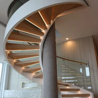 Escalier en colimaçon moderne en acier au carbone pour intérieur, bâtiment commercial, avec marches en verre et marbre, design écologique pour villa