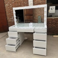 Table de maquillage réglable de luxe, durable, avec 9 tiroirs et grand panneau lumineux, pour salon - Vente en gros