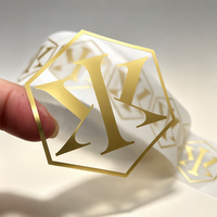 Étiquette d'emballage personnalisée en rouleau, transparente, brillante, imperméable, autocollante, avec logo estampé à chaud en feuille d'or