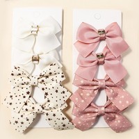 Élégants et mignons nœuds en ruban gros-grain de polyester rose crème uni avec pinces métalliques, accessoires de tête pour chiens et chats, pour l'été, les mariages et la mode quotidienne