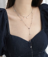 Collier long élégant pour femmes, bijoux de mode féminins, décoration de pull, acier inoxydable, perle blanche, pompon, charme