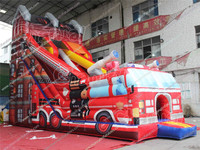 Château gonflable commercial à thème camion de pompiers avec toboggan à obstacles, parcours gonflable et toboggans secs