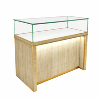Maßgefertigte Steinverkleidung Goldener Metallrahmen Schmuck-Vitrine LED-Beleuchtung Glas-Top-Schaukasten Halsketten-Shop Großhandel Einkaufszentrum