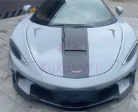 Kit carrosserie pour McLaren GT Style, en fibre de carbone sèche, comprenant un becquet avant, des extensions de jupes latérales, un diffuseur arrière, un aileron arrière et un couvre-becquet.