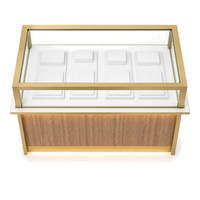 Vitrine îlot en acier inoxydable à grain de bois avec finition dorée et éclairage LED pour bijoux, parfums, cosmétiques, showroom, vente en gros