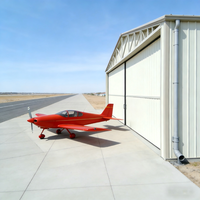 Hangar de luxe préfabriqué en structure acier pour avions privés avec protection incendie, haute résistance au vent et conception durable