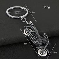 Porte-clés mousqueton moto de simulation cool en alliage de zinc, design roue rotative, résistant aux UV et à l'eau, pendentif de sac automobile, nouveauté, vente en gros