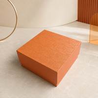 Boîte cadeau rigide personnalisée en gros avec couvercle amovible en papier texturé orange de luxe et intérieur en mousse protectrice
