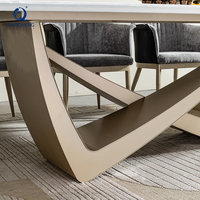 Ensemble de table à manger de luxe en marbre pour 6 personnes avec chaises, base géométrique en acier inoxydable brossé, OEM