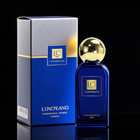 Botol Parfum Kaca Biru Persegi Pipih OLATEC 40 100ML dengan Tutup Bola Emas, Opsi Logo Kustom, Wadah Parfum Mewah