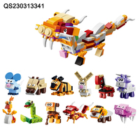 QS Nouveauté Jouets en briques miniatures d'animaux de dessin animé pour la maternelle, en plastique, 12 en 1, ensemble de blocs de construction de dinosaures, jouets en capsule pour enfants