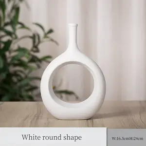 Elegante matte weiße und schwarze Wasser tropfen runde nordische ausgehöhlte Keramik vase