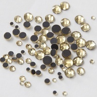 Pierres de strass en cristal à dos plat de l'usine de Yiwu, pierres de strass taillées à la machine, fixation à chaud, DMC, topaze clair, pierre chinoise pour robe