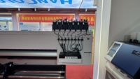 Nouvelle imprimante jet d'encre UV automatique 4 têtes I3200 1800 mm rouleau-à-rouleau 300 dpi 90/h pour l'impression de bannières, de cuir, de cartes et d'étiquettes
