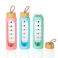 Bouteille d'eau sport grande capacité écologique en verre borosilicate avec couvercle en bambou et manchon isolant en silicone, compatible lave-vaisselle et micro-ondes