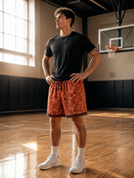Shorts de sport en maille respirante couleur terre cuite, motif triangle rétro, poches latérales zippées, style streetwear, vente en gros