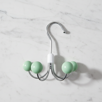 Porte-manteau rotatif à six griffes, design élégant pour rangement domestique, en métal durable