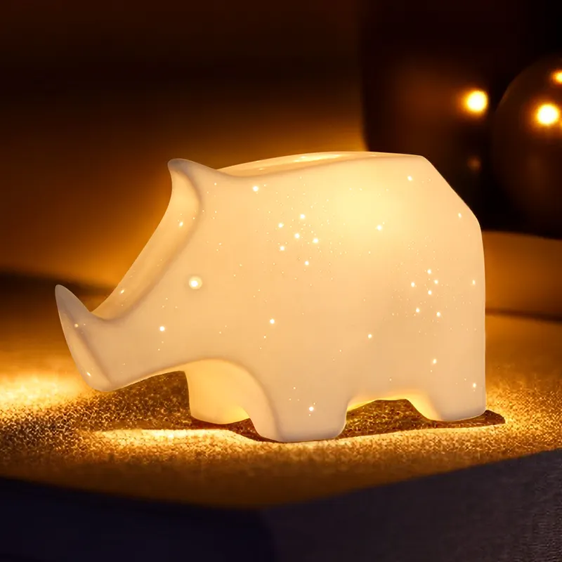 Luce notturna in ceramica a Led rinoceronte carino per bambini camera da letto lampada da comodino elettrica a forma di animale luce per bambini