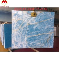 Encimera de mármol azul moderna de piedra de hermanos con vetas doradas Azulejo de suelo de losa de ónix transparente Superficie pulida Uso en apartamento