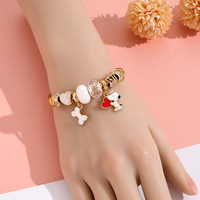 Bracelet en émail Snoopy mignon B158T en acier inoxydable plaqué or 18 carats PVD, ouvert et réglable, avec perles de cristal et pendentif en forme d'os