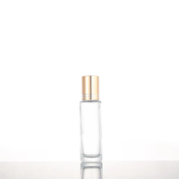 Flacon à rouleau en verre transparent de 15ml avec couvercle en or et rouleau en acier pour bouteille en verre à bille de parfum d'huile essentielle