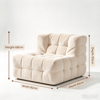 Fauteuil moderne en tissu capitonné avec design modulaire rembourré en peluche pour salon de luxe et coin détente à domicile