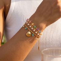 Bracelet OZE transfrontalier européen et américain en acier inoxydable avec perles naturelles colorées et pierres tachetées, coquillages et animaux pour femme