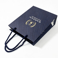 Sac en papier de luxe pour bijoux, sac de shopping personnalisé avec logo estampé à chaud en or et poignée en corde de coton pour l'emballage de bijoux