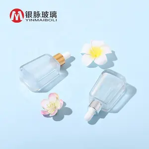 Luxury Square Shaped Essential Oil Cosmetic 30ml Glass Serum Bottle With Rubber Top Dropper Gold Aluminum Cap