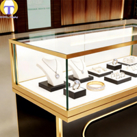 Vitrine à bijoux LED commerciale HongTai, base en aluminium noir, cadre doré, verre trempé robuste et écologique, pour centres commerciaux