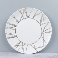 Plats en porcelaine de luxe simples dorés et blancs de 10 pouces
